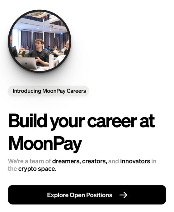 A recruitment graphic featuring a circular photo of team members working with laptops, titled "Build your career at MoonPay," with text describing MoonPay as "a team of dreamers, creators, and innovators in the crypto space" and a button to "Explore Open Positions" — visually promoting the hiring announcement by directing candidates to moonpay.com/careers.