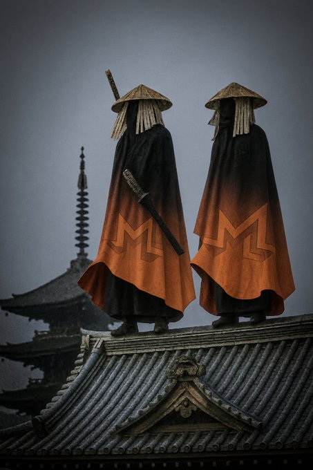 Two figures dressed as ninja or samurai stand on a tiled roof, wearing black and orange cloaks with conical hats and swords, set against a misty temple backdrop.