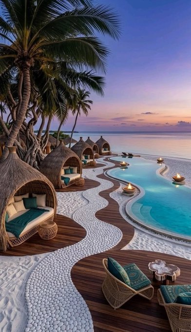 A luxurious beachside resort at sunset features thatched-roof cabanas with teal cushions lining a winding infinity pool, complemented by rattan lounge chairs and palm trees against a twilight sky—evoking a serene, enduring escape that mirrors the post's message about projects that quietly earn attention through consistent, habit-building value rather than flashy demands.