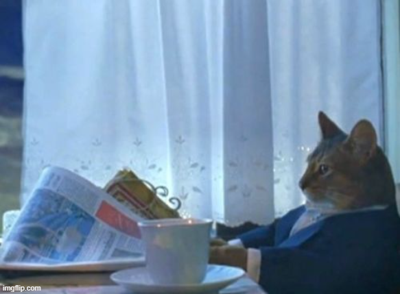 A meme of a cat wearing a blue suit, sitting at a table and reading a newspaper next to a coffee cup and saucer.