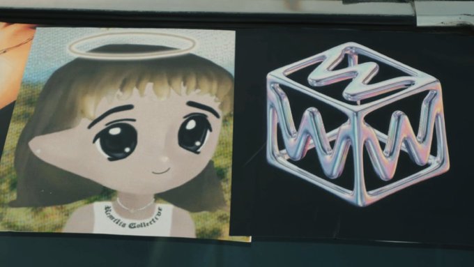 A close-up photo of a trading card featuring an anime-style girl with a halo (labeled "Kallie Calderón") alongside a 3D "W" logo on a black background, visually referencing the stock tickers $W (Wallbox) and $TCAR mentioned in the post.