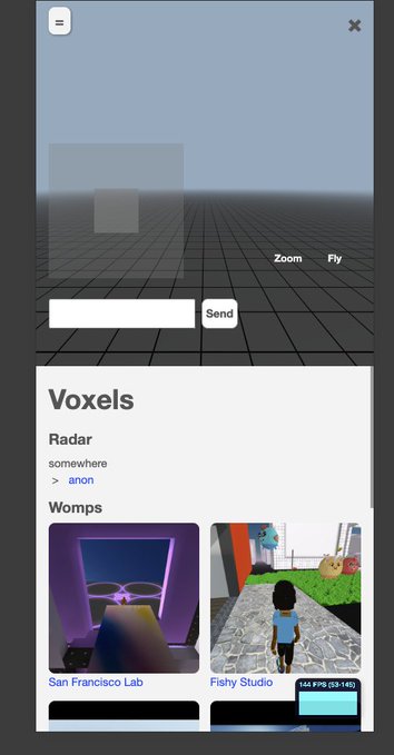 A screenshot of the Voxels virtual world platform showing a 3D grid environment with 'Zoom' and 'Fly' controls, featuring 'Womps' thumbnails including 'San Francisco Lab' and 'Fishy Studio' (144 FPS).