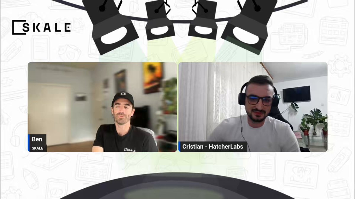 The image shows two men sitting at a table, having a conversation over video call using Skale's platform. The background of the image features multiple lights that are turned on, creating an interesting visual effect. There are also several other objects present in the scene, such as a potted plant and a book placed nearby.