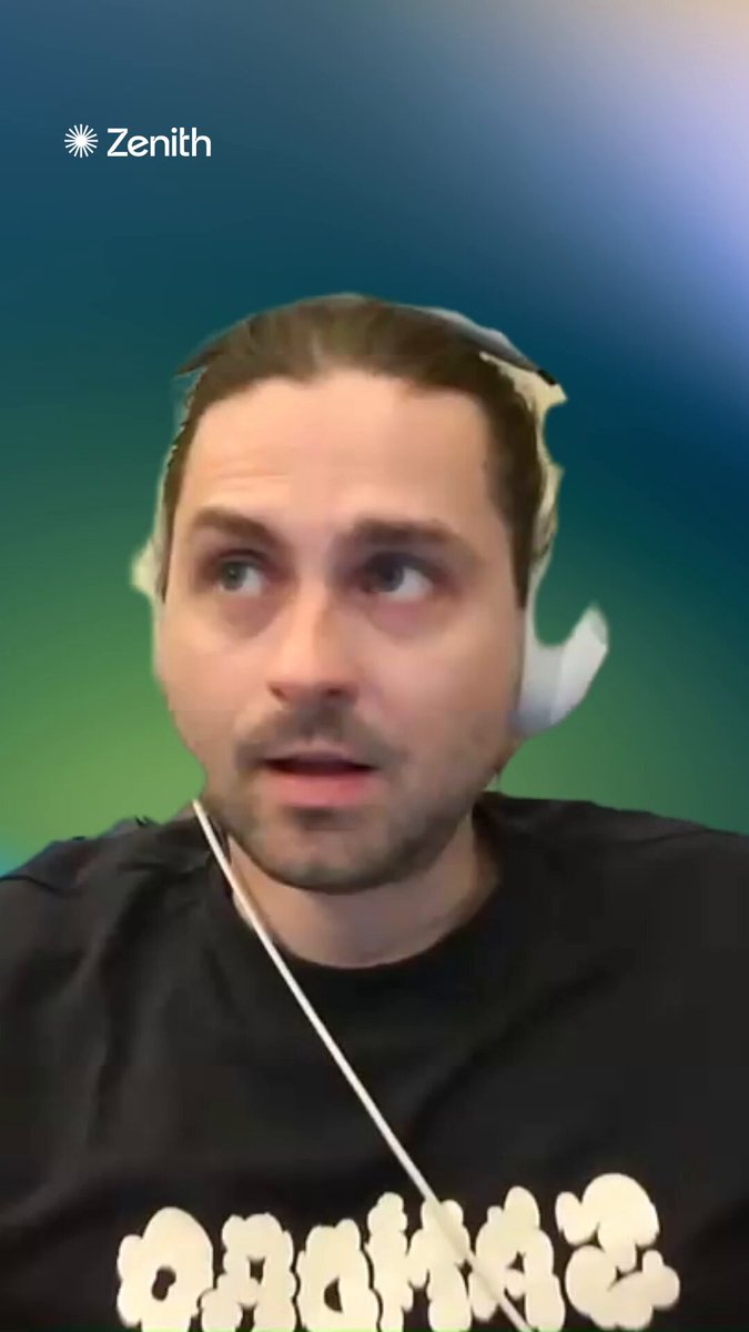 The image shows a man wearing headphones with his face partially obscured by them. The background of the photo has a greenish hue, which contrasts with the white earbuds he's wearing. There are also some words visible in the image that read "Focus on what is in the image and how it relates to the post."