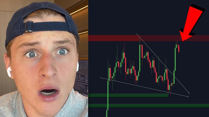 A young man with a backwards cap and AirPods looks shocked as he reacts to a Bitcoin price chart showing a breakout above a descending triangle pattern, highlighted by a red arrow pointing to recent green candles pushing against a red resistance line. The thumbnail emphasizes an urgent "It's happening right now" Bitcoin moment, linking to a YouTube video.