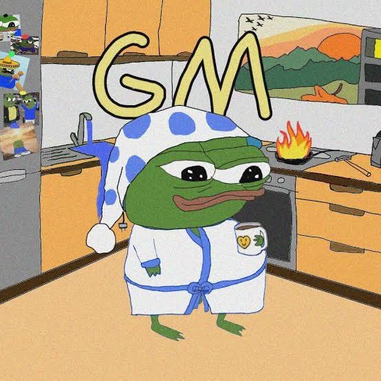 A cartoon image of Pepe the Frog wearing a blue and white polka-dot nightcap and robe, holding a mug, with the text 'GM' (Good Morning) above him in a kitchen setting.