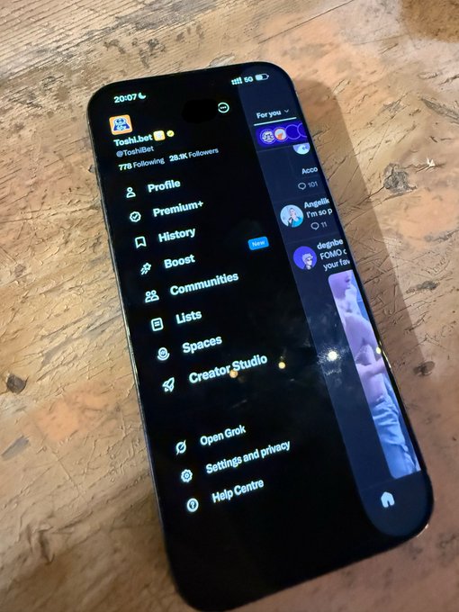 The image shows a smartphone displaying the X (Twitter) app's navigation menu with the user's handle "@ToshiBeto" and "29.3K Followers" visible, along with options like Profile, Premium+, Boost, Communities, and the "Post" button highlighted at the bottom—ready for the user to quickly compose a tweet.