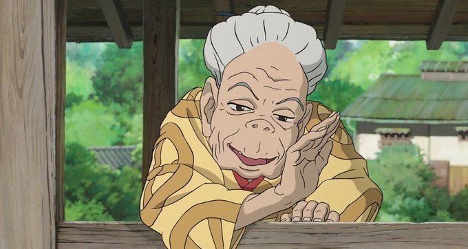 A cartoon woman with gray hair wearing a yellow robe and headband leans over a wooden fence or ledge, giving the impression of resting or contemplating. The background includes trees, indicating an outdoor setting, which adds depth to the scene. In the image accompanying the text, someone has written, "I think savings-loving Japanese people won't buy Bitcoin going forward", implying that the woman in the cartoon is likely discussing or speculating about investing in Bitcoin.