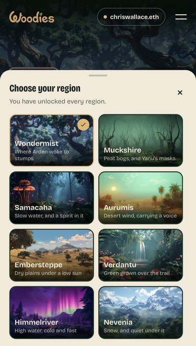 A region selection screen from Woodies (WoodiesOfficial) displays eight unlocked regions: Wondermist (marked with a checkmark), Muckshire, Samacaha, Aurumis, Embersteppe, Verdantu, Himmelriver, and Nevernia. The note from chriswallace.eth explains their ongoing support for the project, highlighting that the user has unlocked every region despite others losing interest in the project.