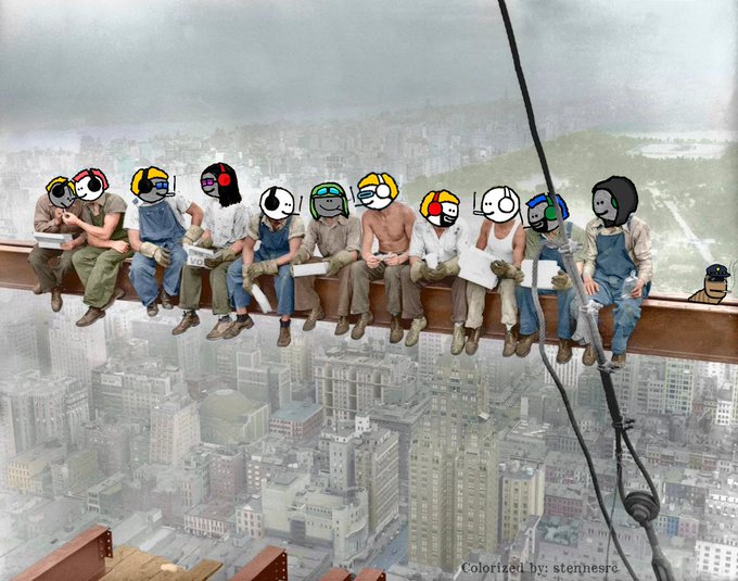 A famous colorized recreation of the 'Lunch atop a Skyscraper' photograph, showing 11 construction workers eating lunch on a steel beam high above New York City, with cartoon emoji heads photoshopped over their faces.
