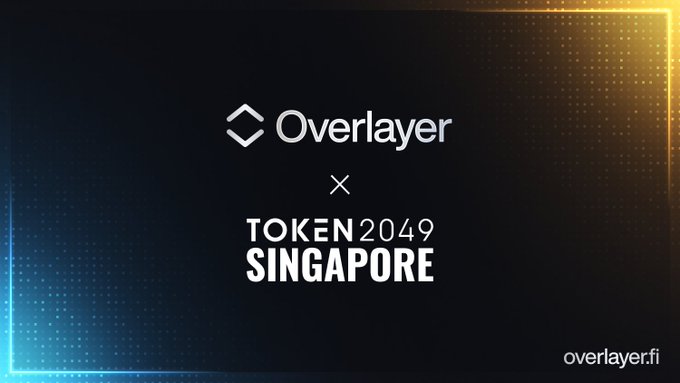 A promotional banner for 'Overlayer × TOKEN 2049 SINGAPORE' featuring the Overlayer logo and website overlay.fi on a dark blue and orange gradient background.