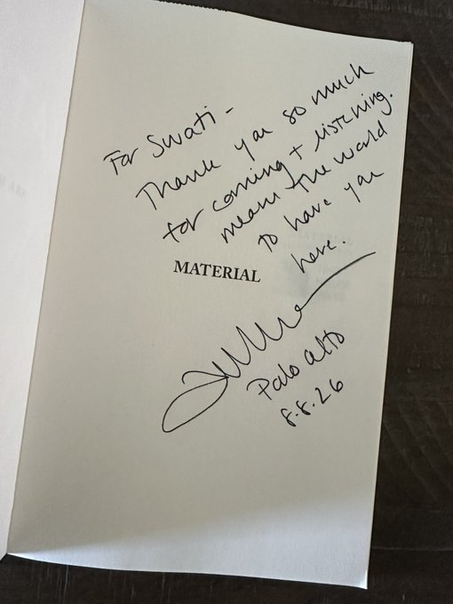 A handwritten note in a book addressed to 'Swati' that reads 'Thank you so much for coming + listening, means the world to have ya here,' signed and dated 'Feb 2025 Ft. 26,' with the printed word 'MATERIAL' visible.