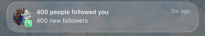 Notification banner reading '400 people followed you, 400 new followers' timestamped 2m ago, featuring a small profile picture with a green link icon.