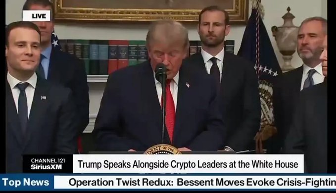 The image shows a live SiriusXM broadcast of President Trump speaking at a White House podium alongside crypto leaders, with the chyron reading "Trump Speaks Alongside Crypto Leaders at the White House." The image visually corresponds to the post's mention of the White House hosting crypto leaders, capturing the official event that coincided with Bitcoin's surge past $68K and the SEC's new crypto regulation guidance.