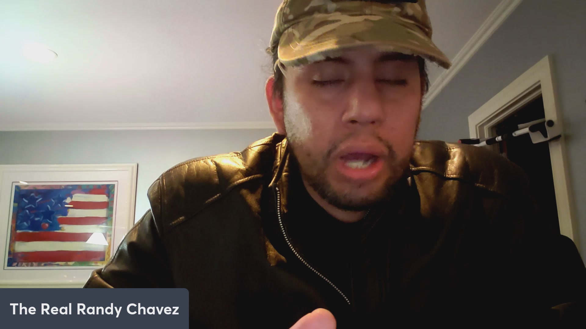 The image features a man wearing a camo hat, black jacket, and a beard. He appears to be looking down at something or someone with interest. The caption of the image reads "VeVe averages 80 new people per day! $OMI $DEFX DACAT NEWS!" which is related to the post about the man's interests in the video game.