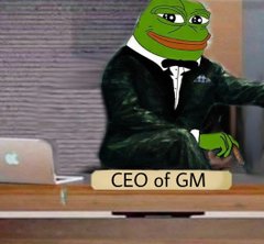 The image shows the "Pepe the Frog" meme dressed in a suit, sitting at a desk with a laptop, captioned "CEO of GM." The meme humorously portrays the CEO of General Motors using the well-known Pepe character.