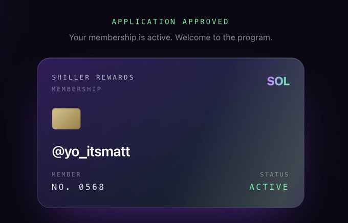 The image shows a credit card application screen with a purple background, displaying an approval message that reads "Your Application Approved Your Membership is active. Welcome to the program." The credit card has a gold stripe running down its center and features a green and purple gradient on the top right corner.