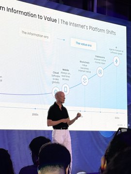 A man in a black shirt presents in front of a large screen displaying a graph titled "From Information to Value | The Internet's Platform Shifts," which plots the evolution of the "Information era" through phases like Mobile/Cloud, Blockchain, and Stablecoins, with markers on the timeline from 2000s to 2020s. The accompanying post suggests this is a Circle event in Türkiye, with the speaker likely being Jeremy Allaire sharing Circle's vision for the global and Turkish market.