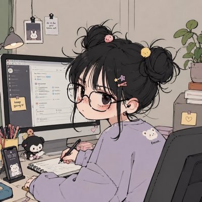 Anime-style illustration of a girl with glasses, dark hair in double buns with cute hair clips, wearing a purple sweater, working at a desktop computer in a cozy room.