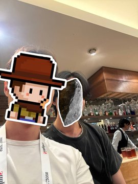 A photo taken at a side event of WebX in Japan, where two people are posing together— one's face is covered with a pixelated cartoon cowboy sticker and the other with a shoe sticker, obscuring their identities. Visible text on lanyards reads "75069" and a logo that appears to be "oinz" (likely the CoinZ crypto community). The image captures the moment described in the caption: meeting the CoinZ founder in person for the first time at an overseas event after previously only knowing them by nickname and Telegram channel.