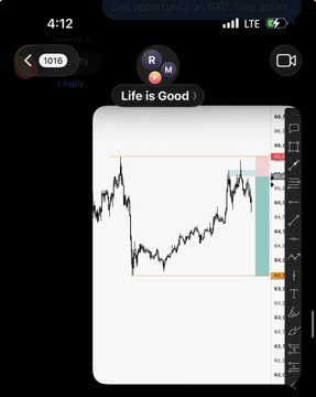 A smartphone screen displays a BTC/USD candlestick chart on a trading platform, with the user "Life is Good :)" posting, alongside a 1010 emoji reaction, indicating bullish sentiment about Bitcoin's upward price movement.