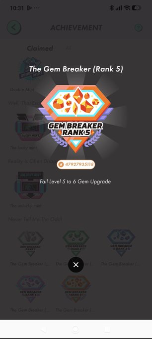 The image shows a phone screen displaying a game achievement page for "The Gem Breaker" game, with various achievements and badges displayed. The text on the screen reads "achievement", "claimed", and "ranked 5". There are also icons representing different achievements such as "fall level 3 to 4 gem ranks", "jump level 1 to 2 gem ranks", and "jump level 0 to 6 gem ranks".