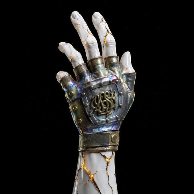 3D render of a white marble hand with golden cracks, wearing an ornate iridescent metal gauntlet with a monogram crest on the back, set against a black background.
