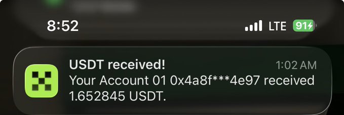 A smartphone notification screen showing a USDT cryptocurrency transaction, reading 'USDT received! Your Account 01 0x4a8f***4e97 received 1.652845 USDT' at 1:02 AM.