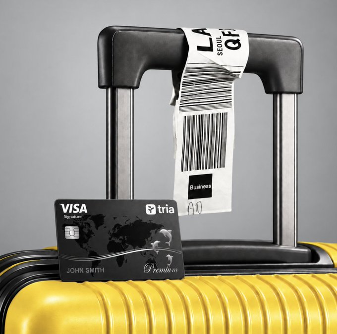 A 3D render of a yellow suitcase with an extended handle that has a 'LAX SEOUL' baggage tag attached, alongside a black 'VISA Signature' and 'tria' branded credit card belonging to 'JOHN SMITH'.