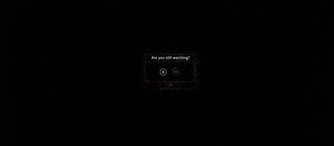 A small, dark semi-transparent pop-up box appears on a black background asking 'Are you still watching?' with 'YES' and 'NO' buttons.