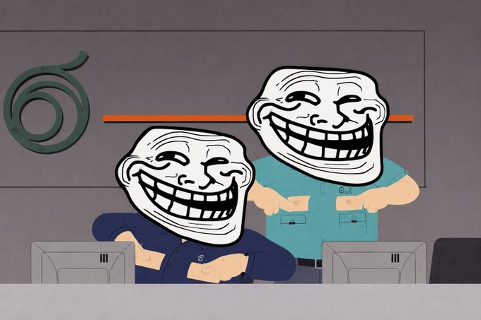 An animated cartoon scene featuring two trollface characters sitting at computers, with one wearing a blue shirt and the other in teal.
