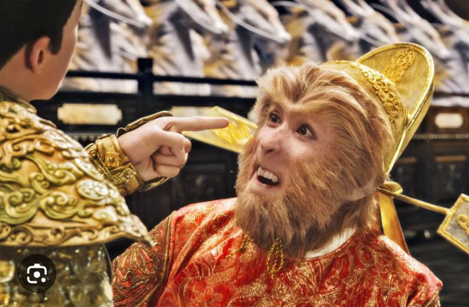 The image shows a man wearing an orange and gold costume, possibly representing a character from a movie or play. He has a large beard and mustache, giving him a unique appearance. Another person is pointing at him with their finger, which could be interpreted as them trying to tell me that the XRPL (Xenon Research Laboratory) does what Metalus can do. The context of this interaction suggests that they are discussing or comparing the capabilities of the XRPL and Metalus in terms of their respective powers or abilities.