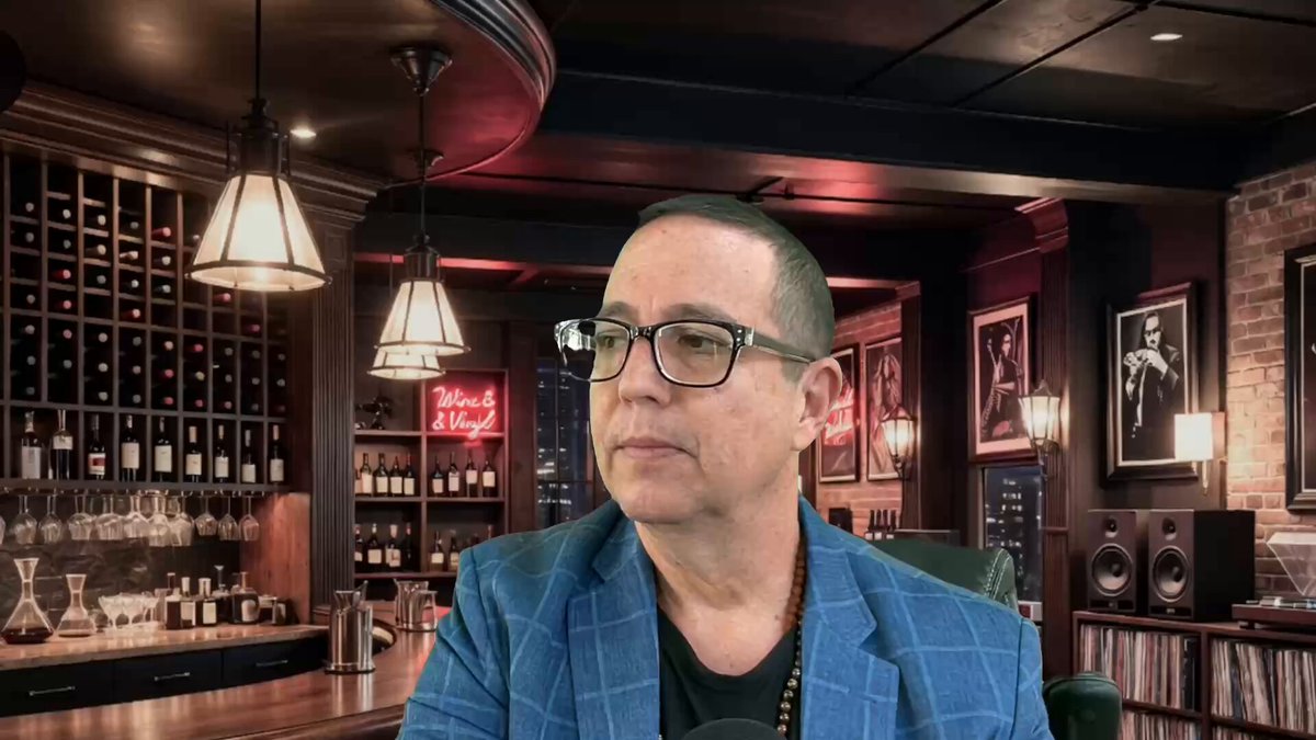 The image features a man wearing glasses, sitting at a bar with several bottles of wine behind him. The man appears to be looking off into the distance or deep thoughtfully. There are also some books visible near the bottom right corner of the image. The caption "SWIFT & Ripple Partners Pilot RIGHT NOW youtu.be/yCPBoY8mNho" suggests that this is a promotional post for a new cryptocurrency called SWIFT & Ripple, which could be related to the man's thoughts or interests in the bar setting.

The presence of multiple bottles of wine and books indicates that the man might be enjoying some leisure time at the bar while contemplating his thoughts on the SWIFT & Ripple partnership. The image also includes a neon sign for "Jazz" above the man, which could potentially be related to the music genre he enjoys or the atmosphere of the bar.