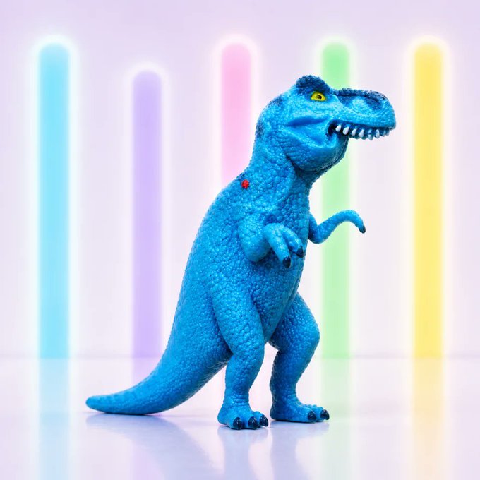 A blue Tyrannosaurus rex toy stands on a reflective surface against a background of vertical pastel-colored neon lights.
