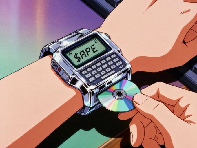 An anime-style illustration shows a hand inserting a CD into a chunky futuristic watch device displaying "$APE" on its screen, visually reinforcing the post's message of buying or "loading up" on the $APE token.