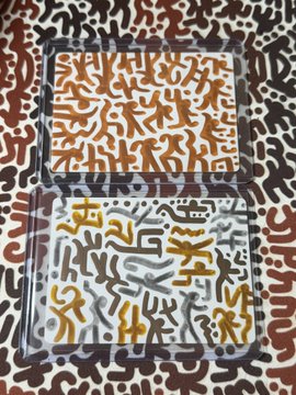 An abstract painting featuring small, repetitive humanoid figures in brown and white/gray, organized into rectangular framed panels against a patterned background.