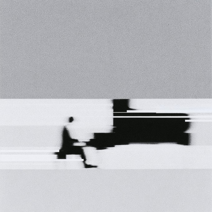 A stylized black and white motion-blurred image showing the silhouette of a person running.