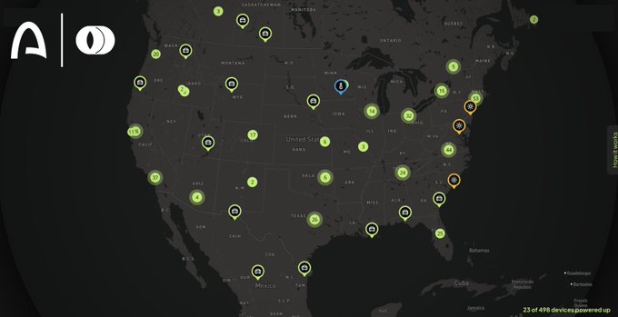 A dark map of North America showing various green device icons scattered across the region, with a logo in the top left and '23 of 478 devices powered up' at the bottom.