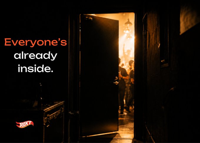 Dark, moody photograph of people inside a warmly lit room viewed through an open doorway, with the text 'Everyone's already inside.' and a 'REKT' logo.