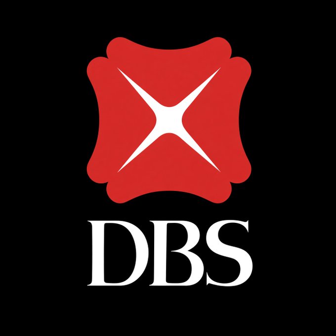 The DBS logo, featuring a distinctive red emblem with a white X-shaped design above the bold white letters "DBS" on a black background, accompanies news of the bank's groundbreaking weekend USD tokenized deposit payment with Citi to the U.S.