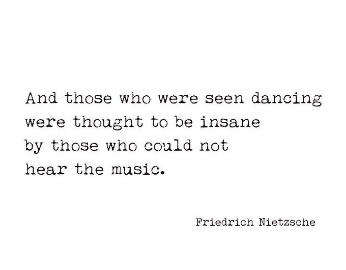 The image features a quote from Friedrich Nietzsche, which reads "And those who were seen dancing were thought to be insane by those who could not hear the music." The quote is written in black text against a white background, making it stand out prominently.