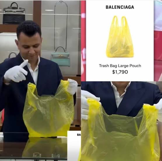 A man in white gloves presents Balenciaga's "Trash Bag Large Pouch" priced at $1,790, alongside an advertisement showing the bright yellow plastic bag styled as a luxury handbag, humorously illustrating the post's point about consumer willingness to spend lavishly on absurd "unique" designer items while dismissing cryptocurrency as a scam.