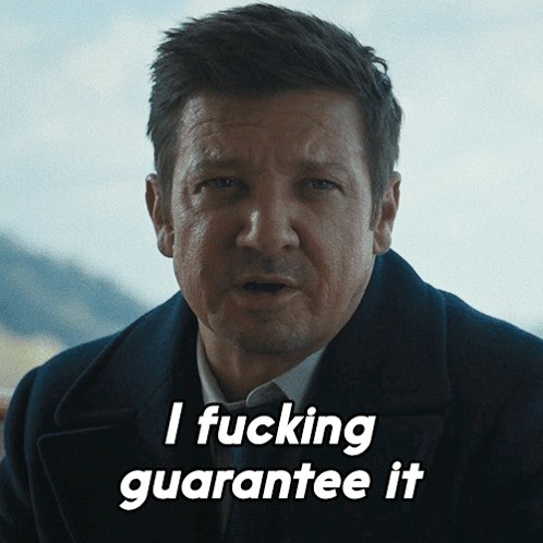 The image features a man with short hair wearing a suit, who appears to be speaking or making a face as he looks at the camera. Below him, there's text that reads "I Fucking Guarantee It" written in black marker. The caption also mentions that the image is related to a post on social media called "Stellar runs on Palantir".