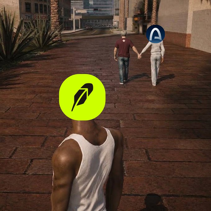 A video game scene showing a muscular man in a white tank top watching an elderly couple holding hands walk down a brick street, with logos (a yellow feather icon and blue 'A' symbol) obscuring their faces.