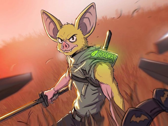 A fierce yellow bat-like creature with large ears stands battle-ready in a grassy field, gripping a sword while wearing a vest displaying a green "HOODRAT" patch with a bat symbol, visually embodying the post's declaration that "hoodrat will prevail."