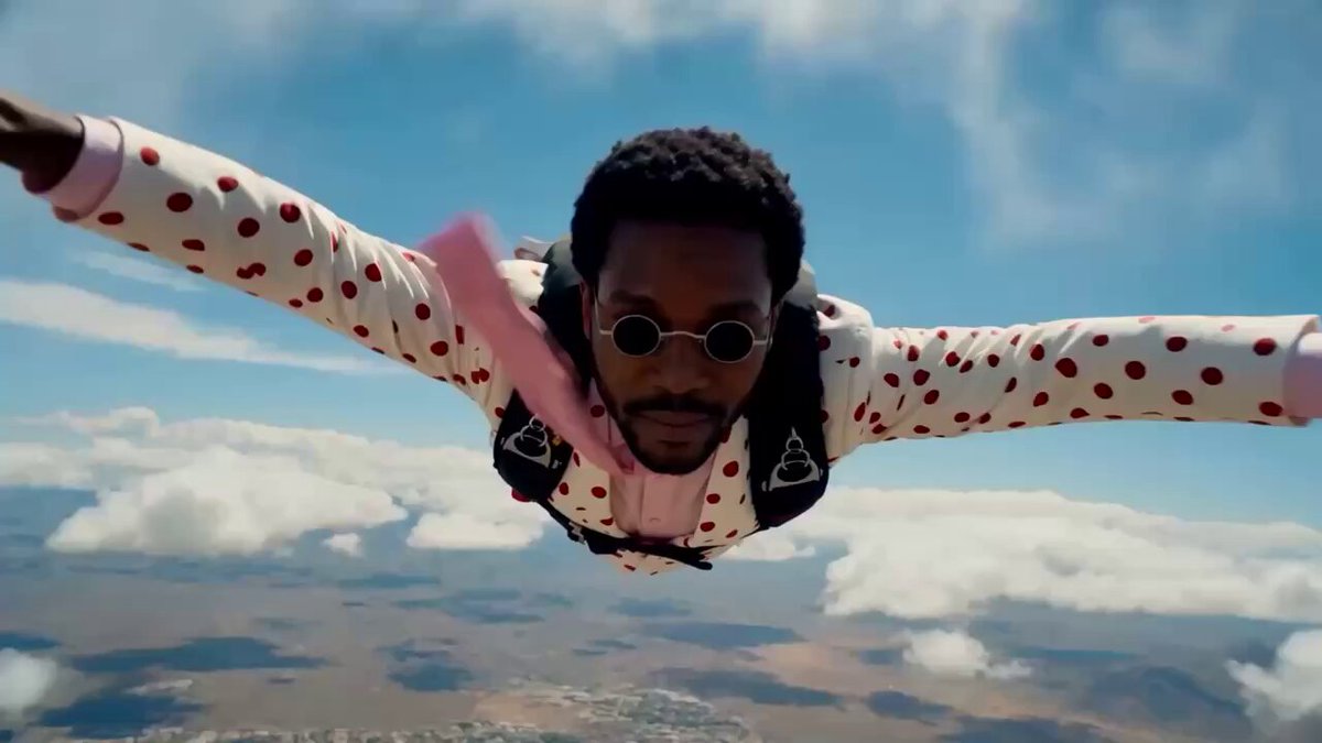 The image features a man wearing a polka dot shirt, sunglasses, and a backpack flying through the air with his arms outstretched. The background shows a beautiful sky filled with clouds, giving the impression that he's soaring above an ocean or another body of water. The caption below the image reads "BREAKING: the World Series of Poker now accepts crypto buy-in with Solana pay zero processing fees powered by MoonPay live today we're proud to be the official crypto payments infrastructure of @WSOP". This suggests that the man is participating in a virtual poker game, and his actions are related to the post's content.