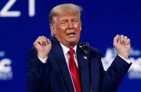 Donald Trump, speaking at a rally, appears to be expressing his strong stance on making cryptocurrency legally viable for businesses in the U.S. The image depicts his characteristic energetic speaking style, aligning with the post's interpretation of his commitment.