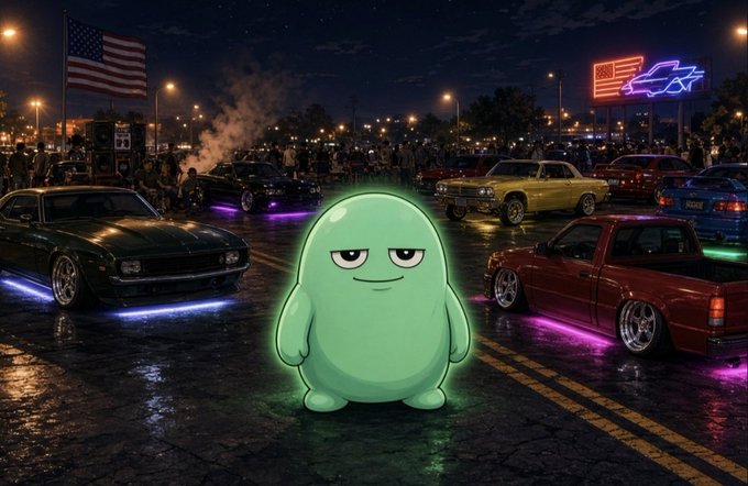 A glowing green cartoon blob character with half-lidded eyes stands in the center of a nighttime car meet, surrounded by classic cars with neon underglow, with an American flag and neon signs in the background.