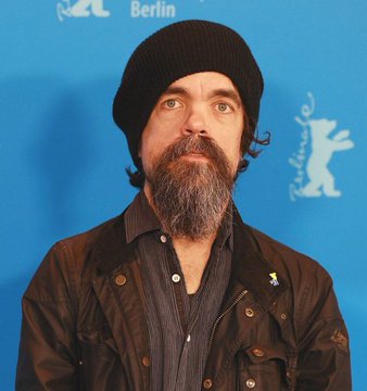 A bearded man wearing a black beanie and dark jacket stands before a backdrop featuring the "Berlinale" film festival logo and "Berlin" text, identified in the post as Jack Dorsey, the Bitcoin advocate predicting the cryptocurrency will surpass $1 million by 2030.