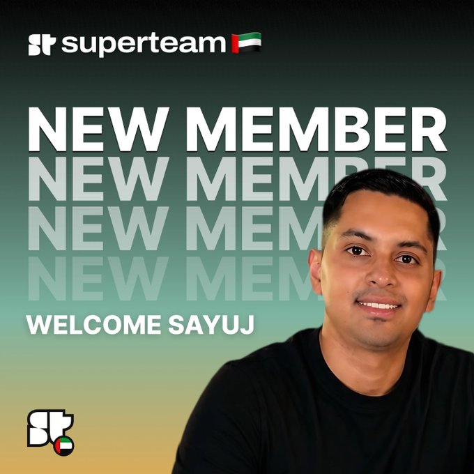 The image features a man smiling at the camera with the text "NEW MEMBER" written above him. The background of the image is black, but there are white letters scattered around that read "NEW MEMBER NEW MEMBER NEW MEMBER". This suggests that the image might be related to an event or promotion for a new member joining a group or organization.
